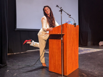 Shannon Smith delivering applied neuroscience keynote on stage at a corporate event